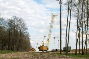crawler crane working in a forrest
